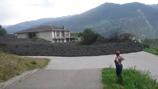 Mudslide barrels through Swiss town [upl. by Adnirb]