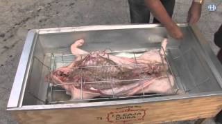 How to roast a whole pig in a Caja China [upl. by Eanram]