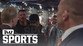 GSP vs Bisping Threats Cussing Insults In Backstage Standoff  TMZ Sports [upl. by Enelyad]